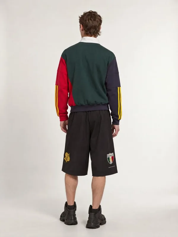 First generated back view: plain back, front shorts emblems wrongly on the back