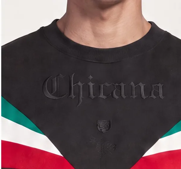 Chest close-up before: lettering reads Chicana with a shield emblem